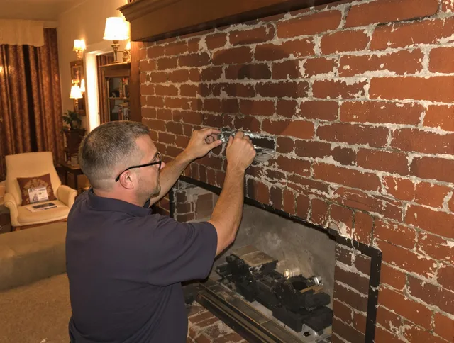Fort Lauderdale Chimney Sweep expert fixing a fireplace in Fort Lauderdale, FL